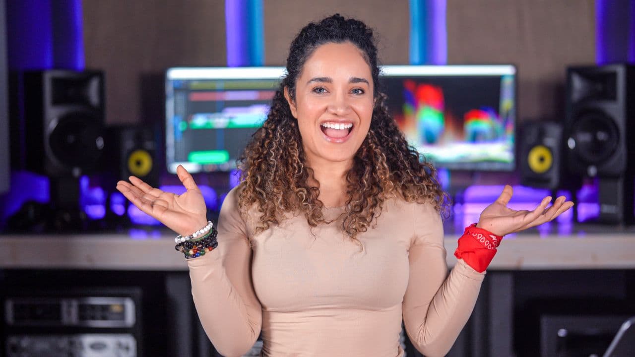 Veronica in front of the editing screens at the PSS studio